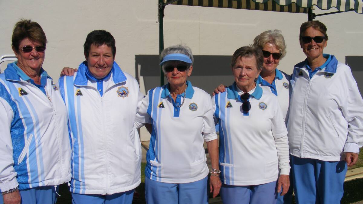 Winners of the NWBC Ladies Triples: Sandra Breust (skip), Kerry Ferguson and Pam Grant are congratulated by runners-up Denise Holman, Gail Palmer and Gail Riley (skip).