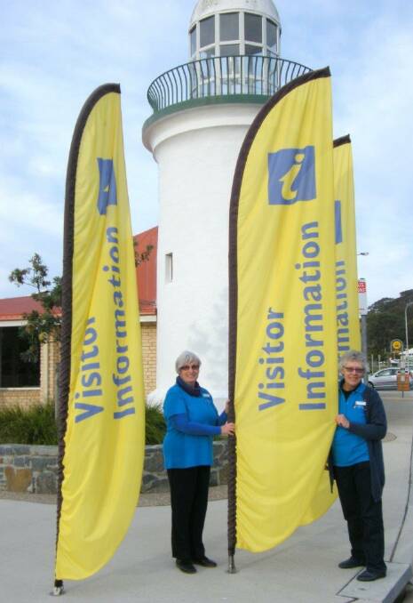 Narooma Information Centre staff member Adrianne Waterman and MACS volunteer Chris Perrott in new "Narooma blue" uniforms.
