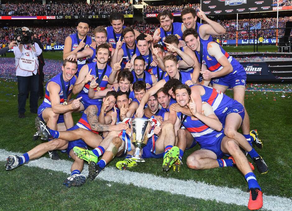 The Western Bulldogs pose with the AFL premiership cup after winning the 2016 grand final earlier this month. Photo: Quinn Rooney/Getty Images