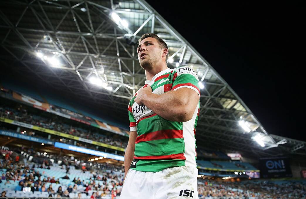 Sam Burgess of the Rabbitohs holds his shoulder as he leaves the field injured during the round 14 NRL match between the Wests Tigers and the South Sydney Rabbitohs in June this year. (Photo by Mark Metcalfe/Getty Images) Sam Burgess