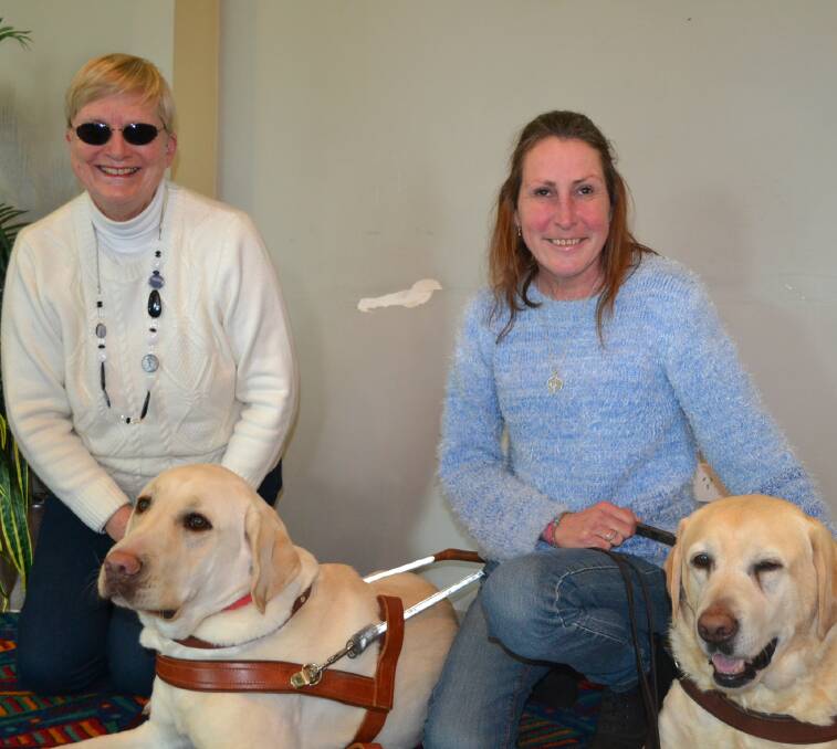 GROUP VISIONS: Elaine Heskett and Sharon Holland with guide dogs Mr Darcy and Wisdom.