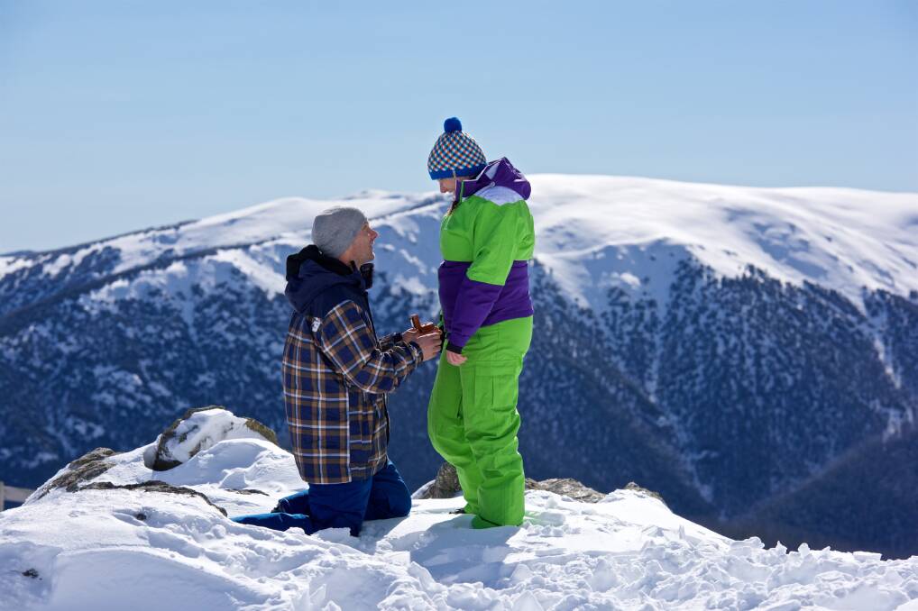 Will you marry me: Nick Evans goes down on bended knee to propose to girlfriend Chantelle James at Falls Creek on Saturday afternoon. Picture: CHRIS HOCKING