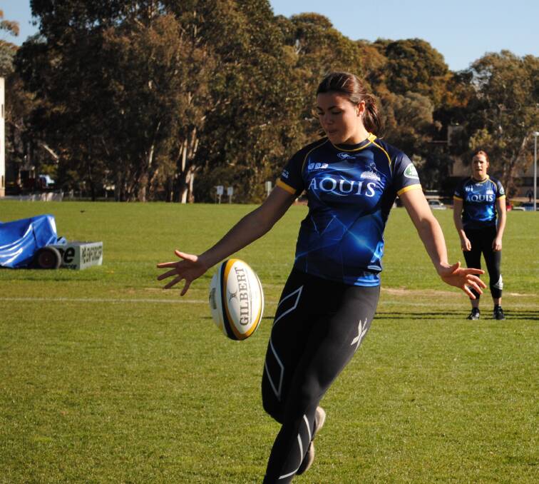 Young gun: Cobargo's Millie Boyle - pictured during a training run with the ACT Brumbies - has been named in the Australian Wallaroos Rugby squad. 