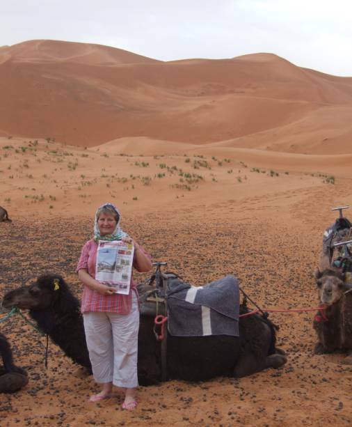 NEWS TRAVEL: Lyn Goldsmith and the Narooma News taking advantage of the only way to travel over the sand dunes of the Sahara Desert in Morocco – a camel.