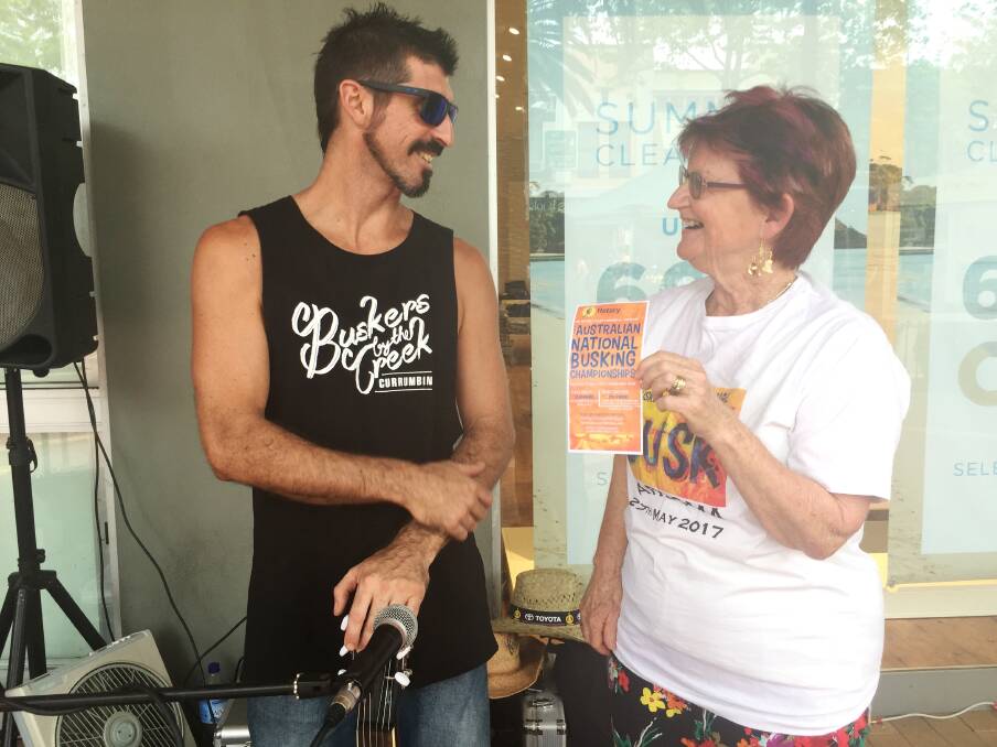 Narooma Festival coordinator Sandra Doyle sings the praises of Narooma and the busking festival to Tamworth busker Kenny Slide from the Gold Coast.  