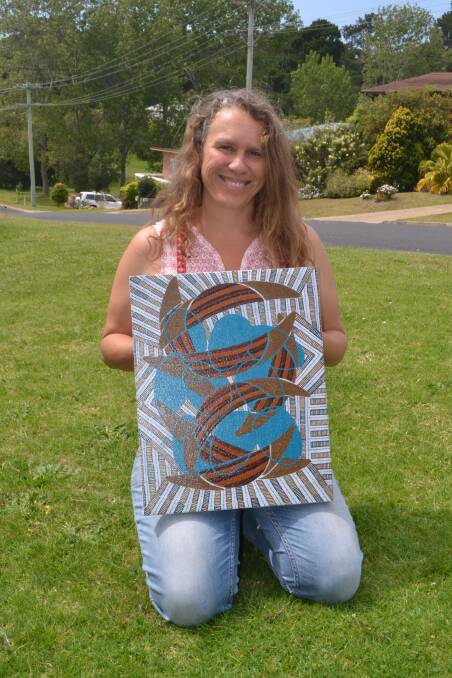 TRAGIC STORY: Dalmeny artist Natalie Bateman with her artwork she previously entered to the competition that depicts the Wagonga tragedy that took the lives of men coming back from Montague Island on canoes.  