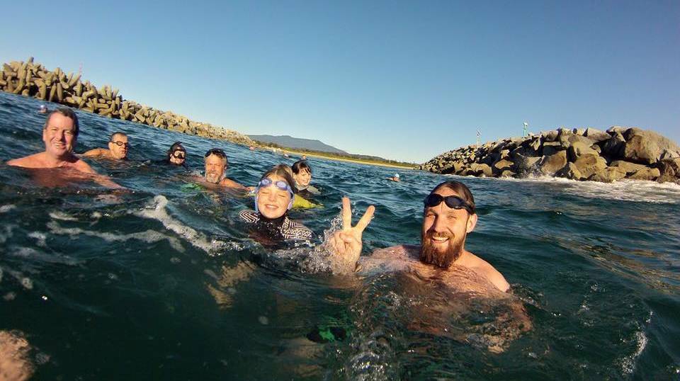 The Narooma Numnutz swim out through the bar on one of their 2016 regular season swims. 