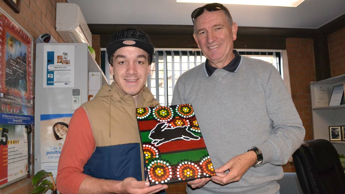 Narooma High School principal Tony Fahey pictured with a recent Indigenous graduate at the school.