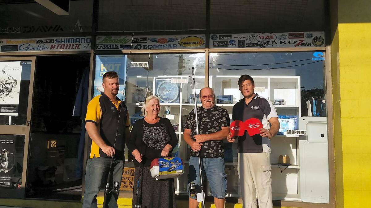 Tomakin Fishing Club president Adam Martin with Anna and Pekka Rantanen and Anthony Stokman, proprietor of Compleat Angler Batemans Bay. 
