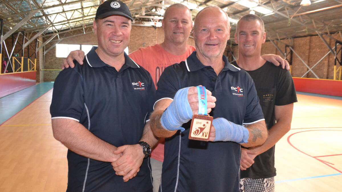 BOXING LEGENDS: Masters Games gold medalist Ken White with PCYC director Gary Traynor, boxing legend Mark "Ziggy" Zielinski and coach Scott Wharfe. 