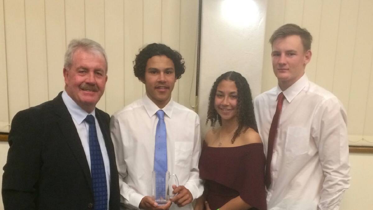Narooma Devils secretary Bob Burnside with Group 16 Under 18 best and Fairest winner Matt Parsons, Janaija Parsons who was placed fourth in Ladies Tag and Group 16 Under 18 rep Devil Jordan Martin at the Group 16 Presentation Night at Cooma last Friday, August 11.