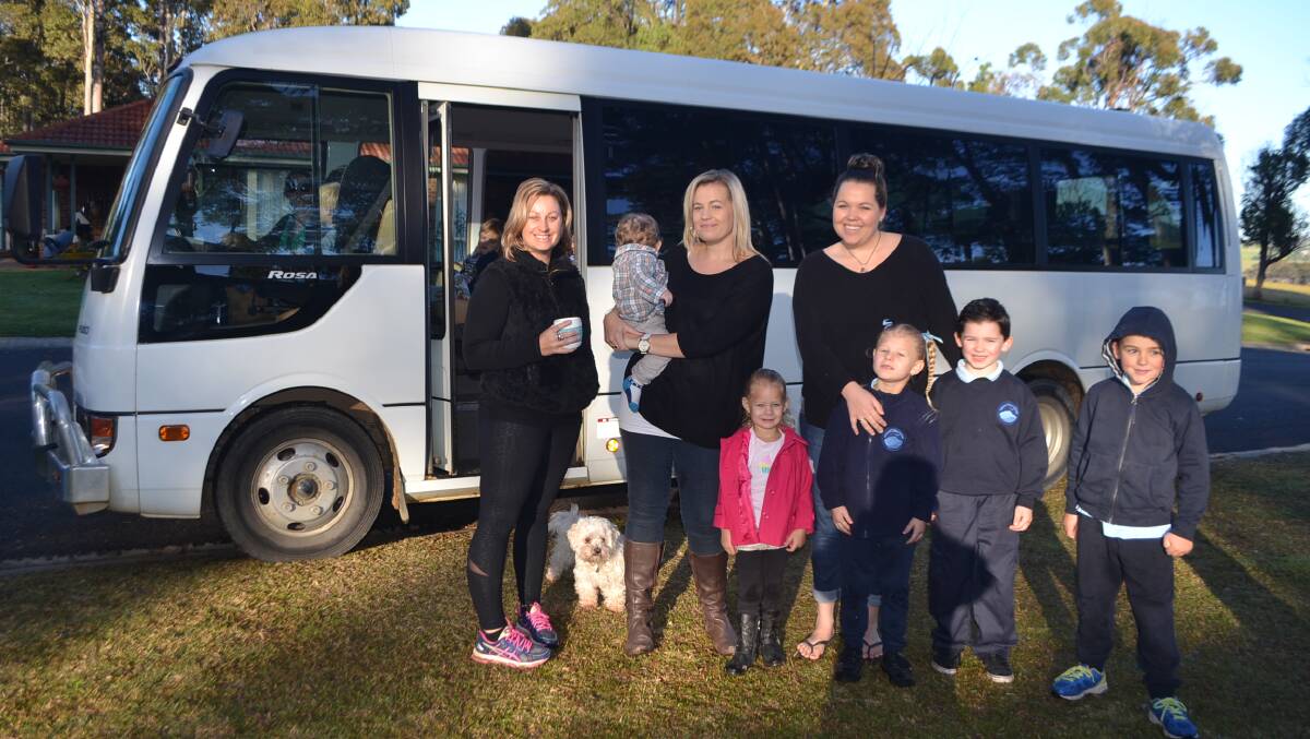 SCHOOL MUMS: Tilba school mums Lee-Anne Eddie, Amy-lee Negus and Ray Stevens with kids Rhylan, Gracie, Molly, Logan and Cody and the bus without seat belts.