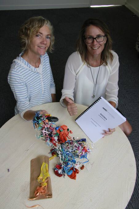 Council’s environment education officer Bernadette Davis and Mayor Liz Innes celebrate the ban of balloon releases at council events and council-managed reserves. They are pictured with balloon litter collected from the shire’s beaches, including one labelled promotional balloon found at Tomakin Cove in January, which travelled all the way from Alexandria in Sydney. 