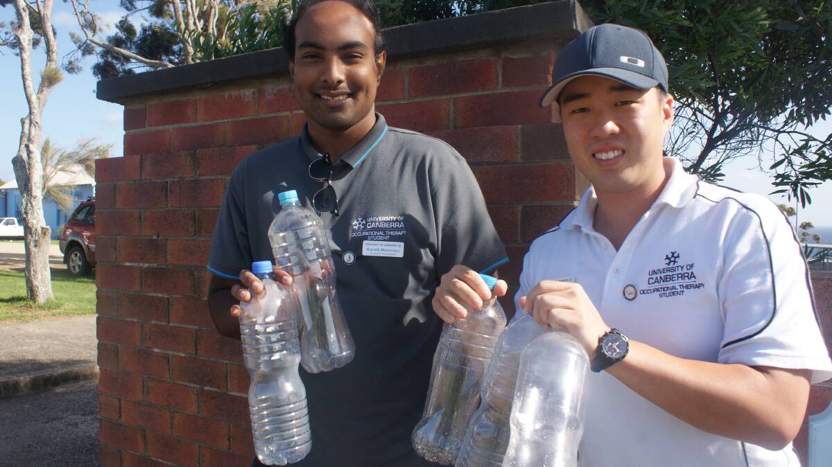 BOTTLES WANTED: Occupational Therapy students from the University of Canberra Kausik McKinnon and Top Suthayakhom are hoping to get your plastic bottles.  