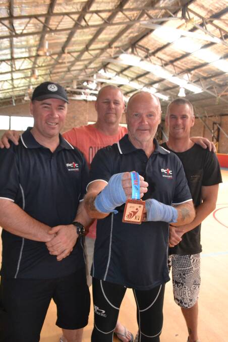 BOXING LEGENDS: Masters Games gold medalist Ken White with PCYC director Gary Traynor, boxing legend Mark "Ziggy" Zielinski and coach Scott Wharfe.