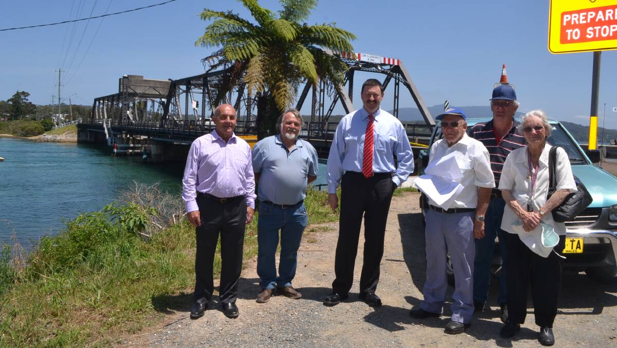 Meeting with Federal Member Mike Kelly at the Narooma Bridge on December 12 are councillor Phil Constable, Ian Hitchcock of the NSW Coastal Alliance, Peter and Dawn Bernard and Ken Dawson. 