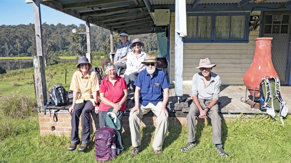 
Dalmeny Narooma Bushwalkers sitting on the still used original old Dignams Creek farm house. From left are Maggie Finch, Jenny Mc Donagh, Margaret Moran, Anita Porter, Steve Deck and Jan Smith, with Michael Mc Donagh not in photo 