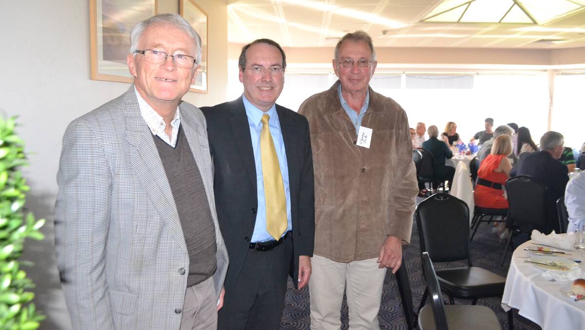 Liberal candidate Dr Peter Hendy (centre) with Tilba and South Narooma Landcare Group president Robert Dunn and member Harry Bate at the Narooma Golf Club when the Premier visited. 