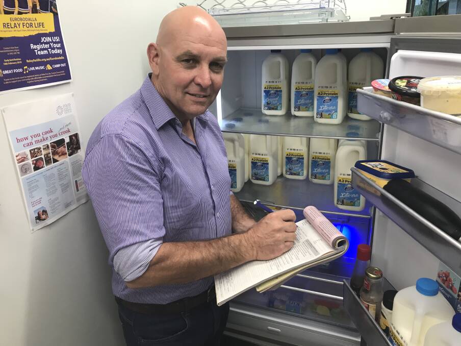 INSPECTION TIME: The Eurobodalla Council’s Environmental Health Officer Michael Jones conducts a food inspection. 
