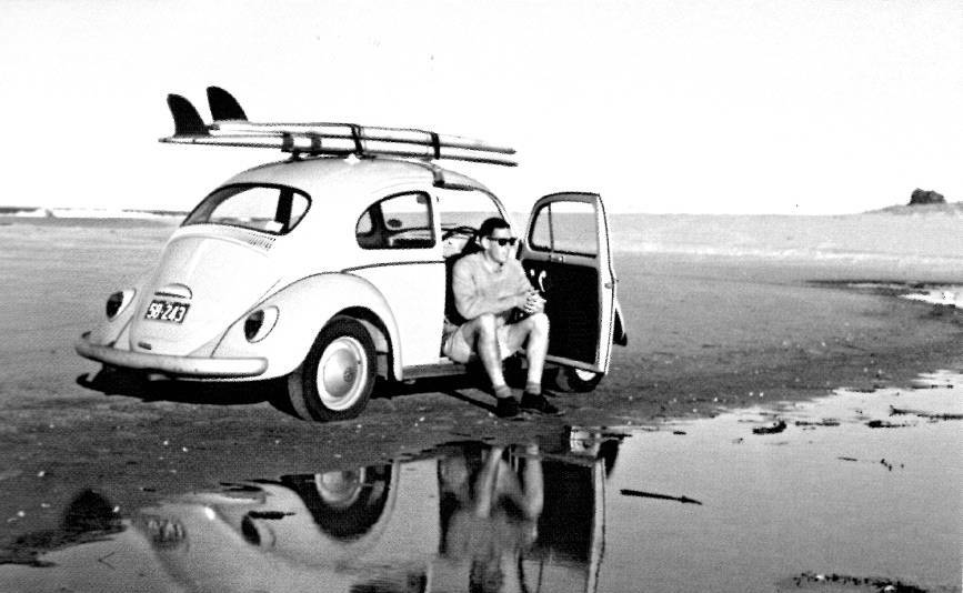 The front cover of Ian Ingram's book "Capital Surfers" features a photograph of him in his VW Beetle parked on Narooma main surf beach in 1964. 