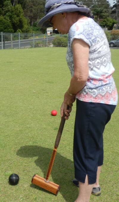 LEARNER PLAYER: Narooma Sporting and Services Club croquet novice player Lyn Edwards learns the ropes. 