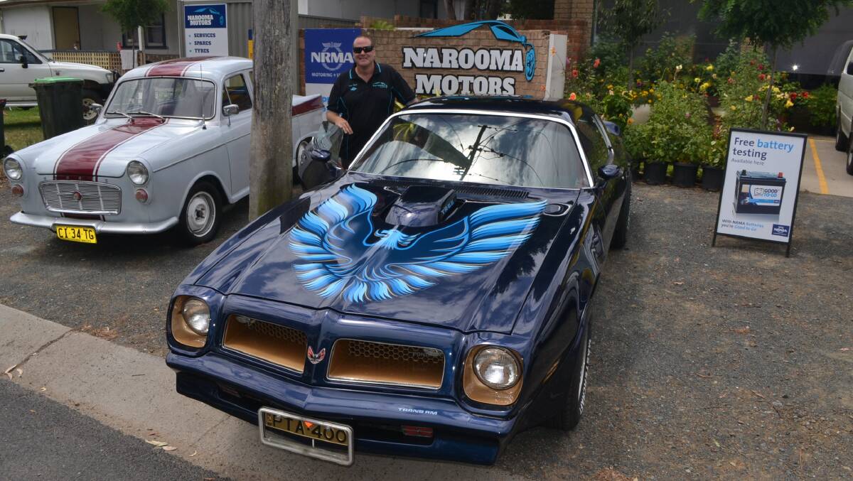 Narooma Motors owner Pete Howe with his 1976 Trans Am and also Nicole Dawson's Morris Major, both cars will be at the classic car show next Saturday. 