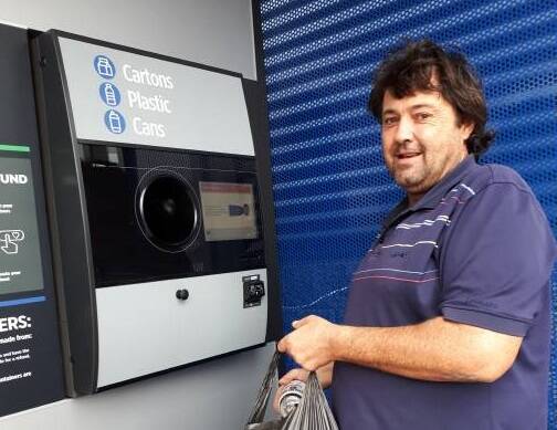 EARN AND RETURNING: Robert Pike of Moruya arrived with a large bag of cans to recycle at the Return and Earn reverse vending machine at Moruya Woolworths. Photo: Jo Rugg