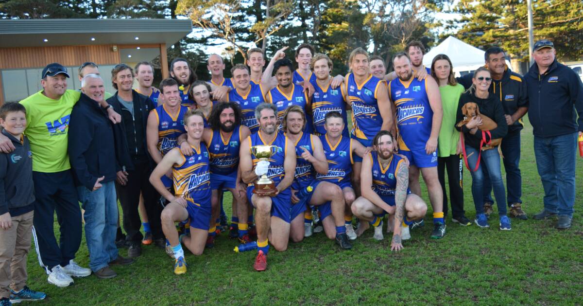 CUP SUBSTITUTE: The Bermagui Breakers AFL squad hold the Melbourne Cup after defeating the Tathra Sea Eagles on Saturday to reclaim the Kenny Jack Cup for the first time since 2012. Picture: Supplied
