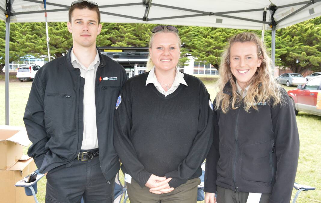 Eurobodalla Shire Council animal rangers Mitchell Stirling, Nikki Grimstone and Farann Mathie assisting dog owners at the Tailwagger's Walk.