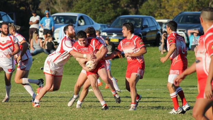 Narooma Devil Todd Wright takes the ball up against Eden last year.