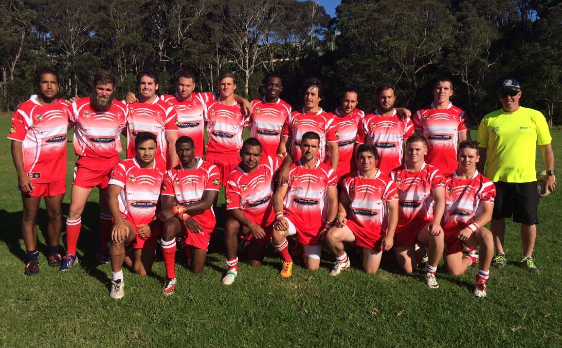 FIRST GRADE: Narooma Devils first grade players and trainer pose for a team picture at last weekend's game.

