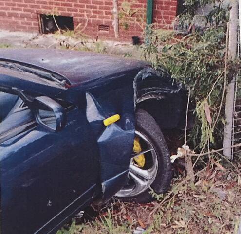 Police found Nathan Merola's car slammed into a metal street sign, having taken out the fence of a home on University Avenue. Picture: supplied