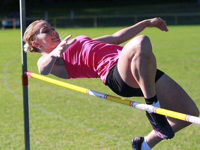 ABOVE AND BEYOND: Lilly Bennett competes in the high jump.