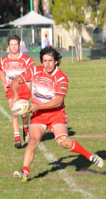 LOOKING FOR SUPPORT: The Narooma Devils go on the attack at Mackay Park on Saturday. They beat Batemans Bay 40 to 24.