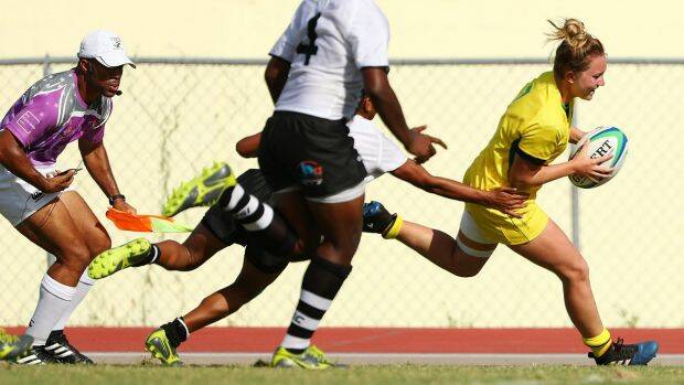 TRY MACHINE: Lilly-Rose Bennett of Australia scores a try during the match between Fiji and Australia in the Girls Rugby Sevens. Photo: Scott Barbour