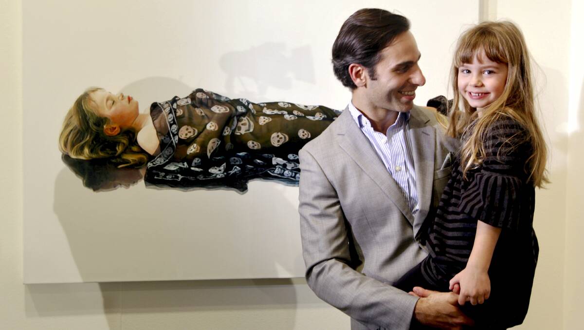 Shirley Hannan National Portrait Award 2016 finalist Michael Zavros - and his five-year-old daughter, Phoebe - in front of his 2010 Doug Moran National Portrait Prize winning painting Phoebe is Dead/McQueen. Photo: Edwina Pickles