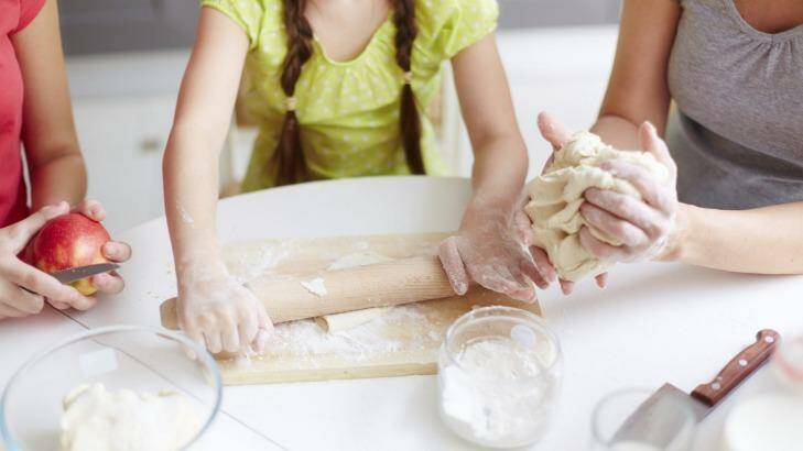 Get your kids helping out in the kitchen. Photo: iStock