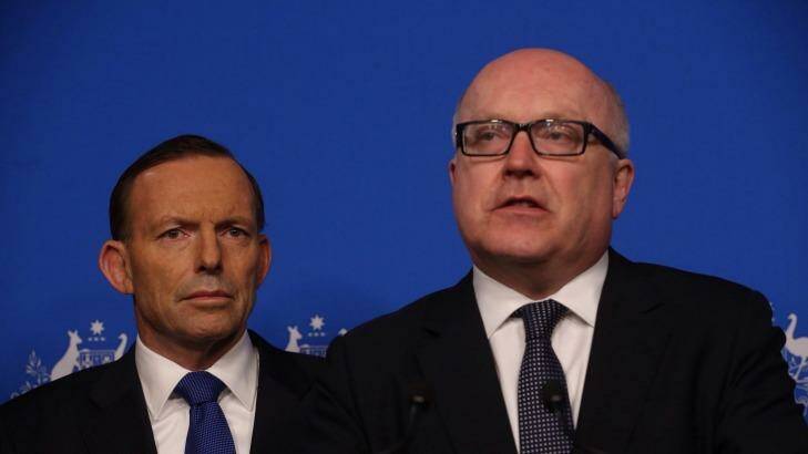 Prime Minister Tony Abbott and Attorney-General George Brandis have had difficulty so far explaining what information telcos would be required to store under new laws. Photo: Andrew Meares