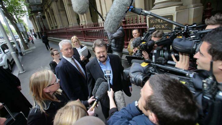 Hinch arrives at court to face charges of contempt over the naming of a sex offender in 2013. Photo: Justin McManus