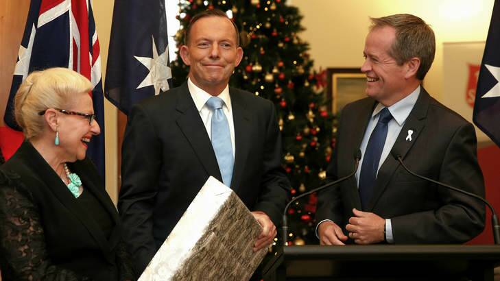 Prime Minister Tony Abbott and Opposition leader Bill Shorten share a joke during the launch of the Prime Minister'??s Christmas Tree in Canberra on Monday. Photo: Alex Ellinghausen