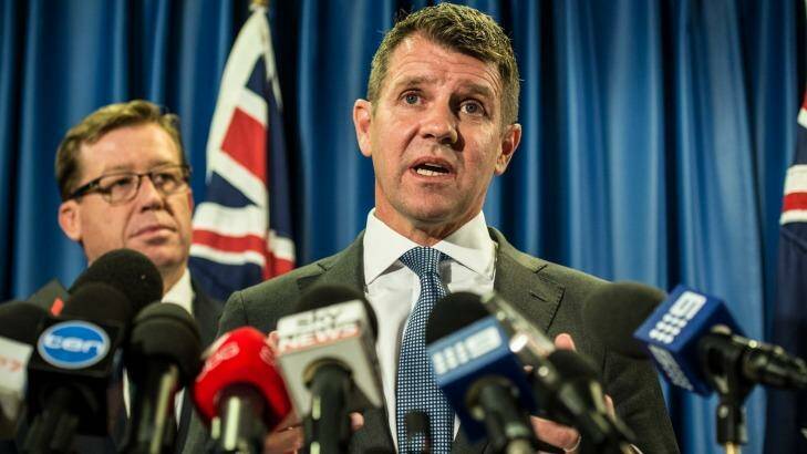 Mike Baird and Deputy Premier Troy Grant announce the greyhound racing reprieve on Tuesday.  Photo: Wolter Peeters