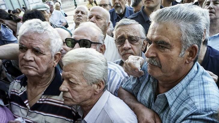 Distraught pensioners have been gathering in small, tense crowds outside banks trying to withdraw their weekly allowance of €120. Many have not been paid. Photo: Milos Bicanski/Getty Images