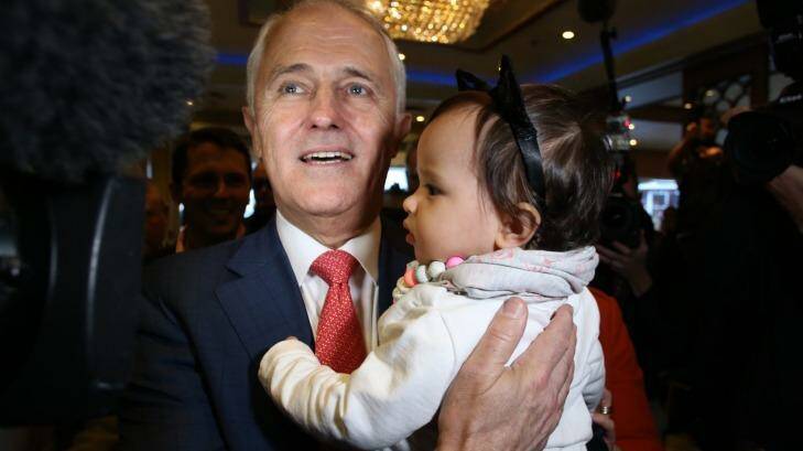 Mr Turnbull hugs his granddaughter Isla as he and Lucy Turnbull arrive at the Sunny Harbour Yum Cha restaurant in Hurstville, Sydney on Wednesday. Photo: Andrew Meares
