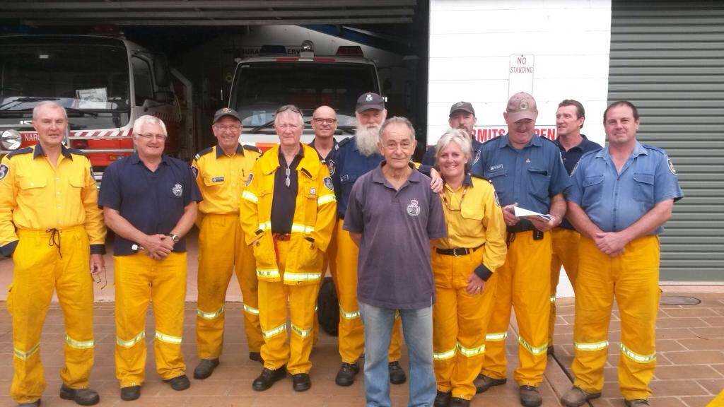 STRIKE TEAM: RFS Eurobodalla Strike Team Alpha 57 at the Narooma fire station just before departing to Delegate on Wednesday included (from
right) David Keogh, Mick Marchini, Greg Hill, Gillian Kearney, Harry Gazhikian, Paul Page and others from Bingie and Surf Beach.
 