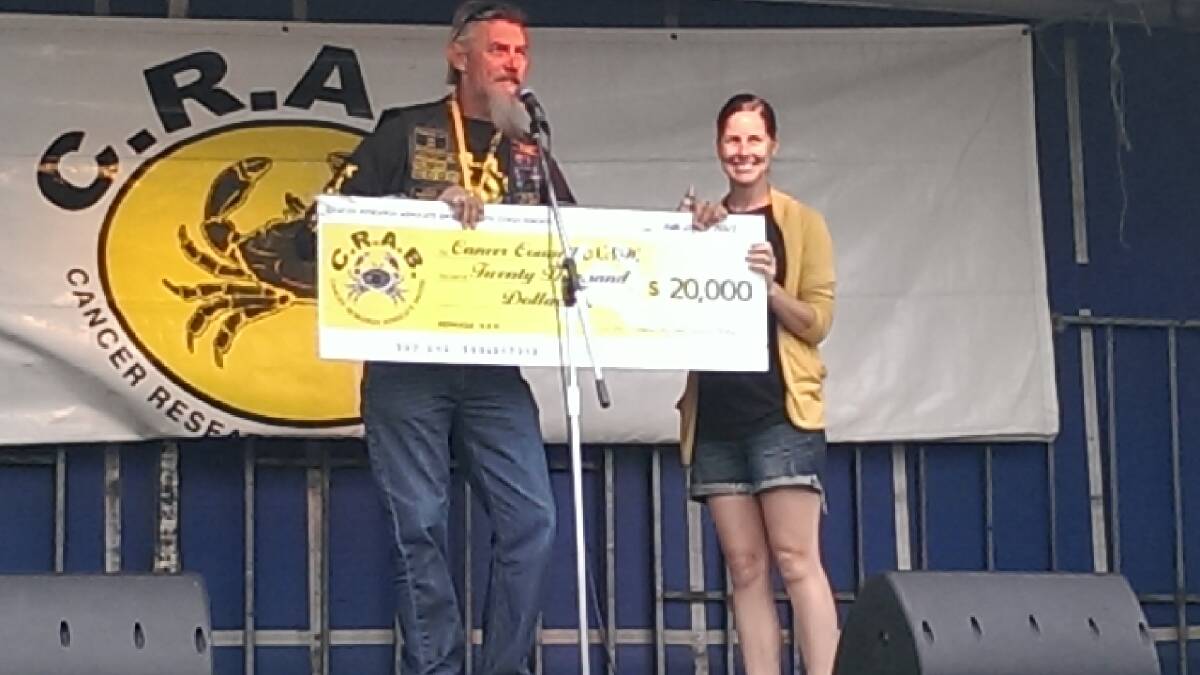 CRABS DONATION: Presentation of cheque for $20,000 by Rob Grimstone, CRABs Bermagui founder and national president, to Sarah Flynn from Cancer Council NSW. 