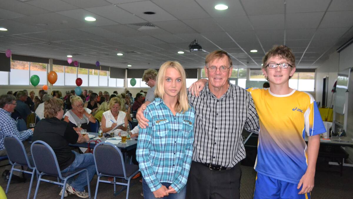 WITH GRANDPA: Lilly Bennett and Connor Griffiths with their grandpa at Saturday’s fundraiser to get them to Cananda to compete in Little Athletics. 