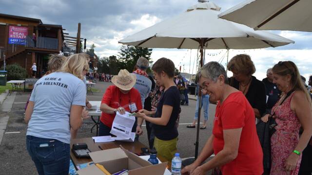 
FESTIVAL TICKETS: Four Winds Festival volunteers handle ticket sales.
