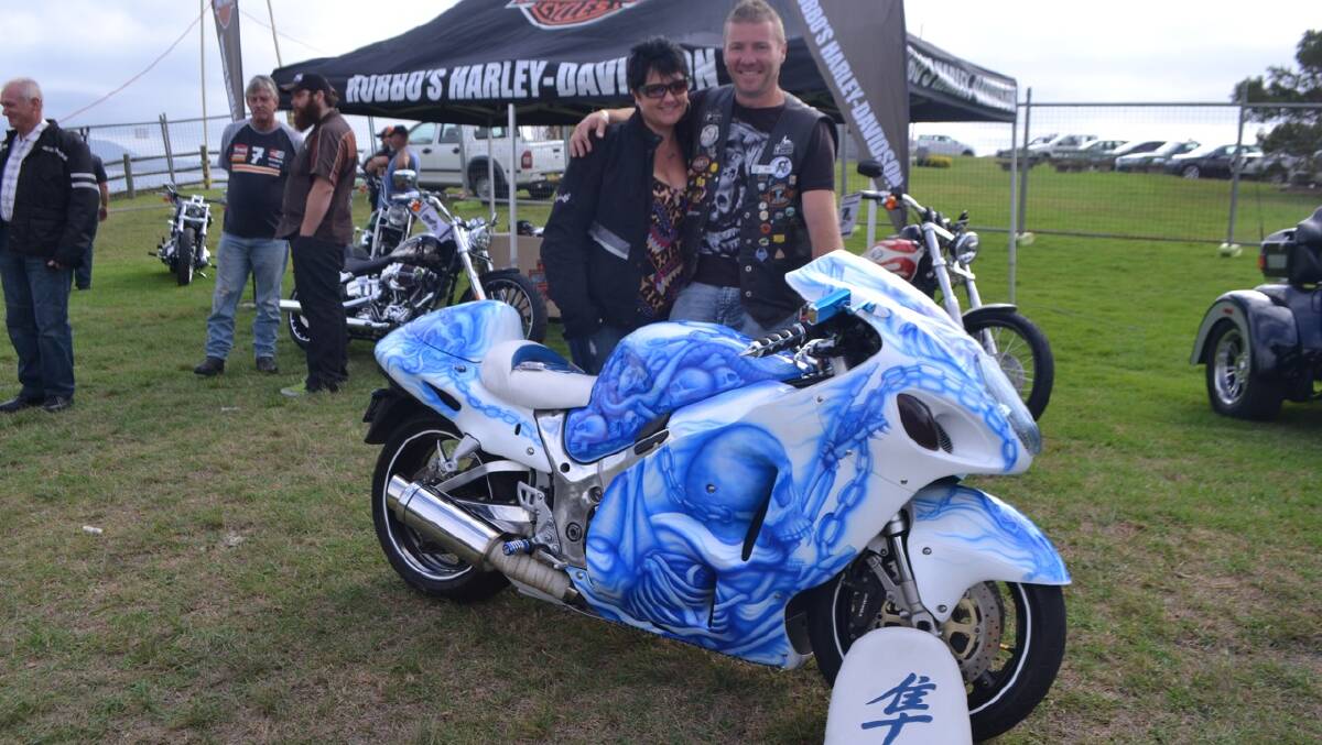 BEGA BIKE: Dan Allen and Katrina Dansey of Bega and the Hayabusa 1300 painted by Nathan Trowbridge of Wolumla with skulls and Medusa – it’s still his daily ride. 