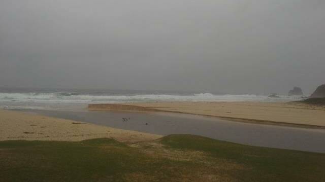 BREAK THROUGH: Andrew Cowley sent us this photo of Little Lake at Surf Beach broken open to the rain on Thursday morning...