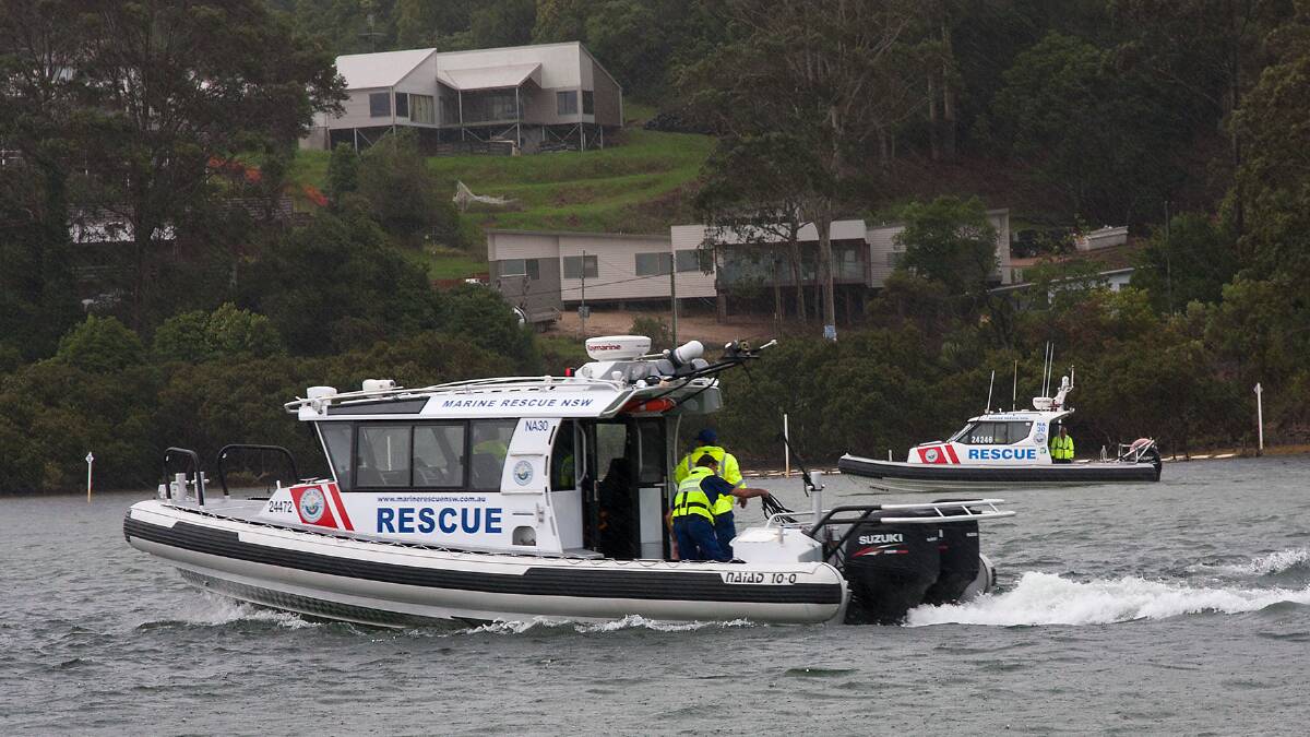 VESSEL LAUNCH: The new 10.2 metre Naiad rescue vessel is launched by Marine Rescue Narooma at the Narooma Bridge on Thursday in the rain. Photo by Brian Gunter 
